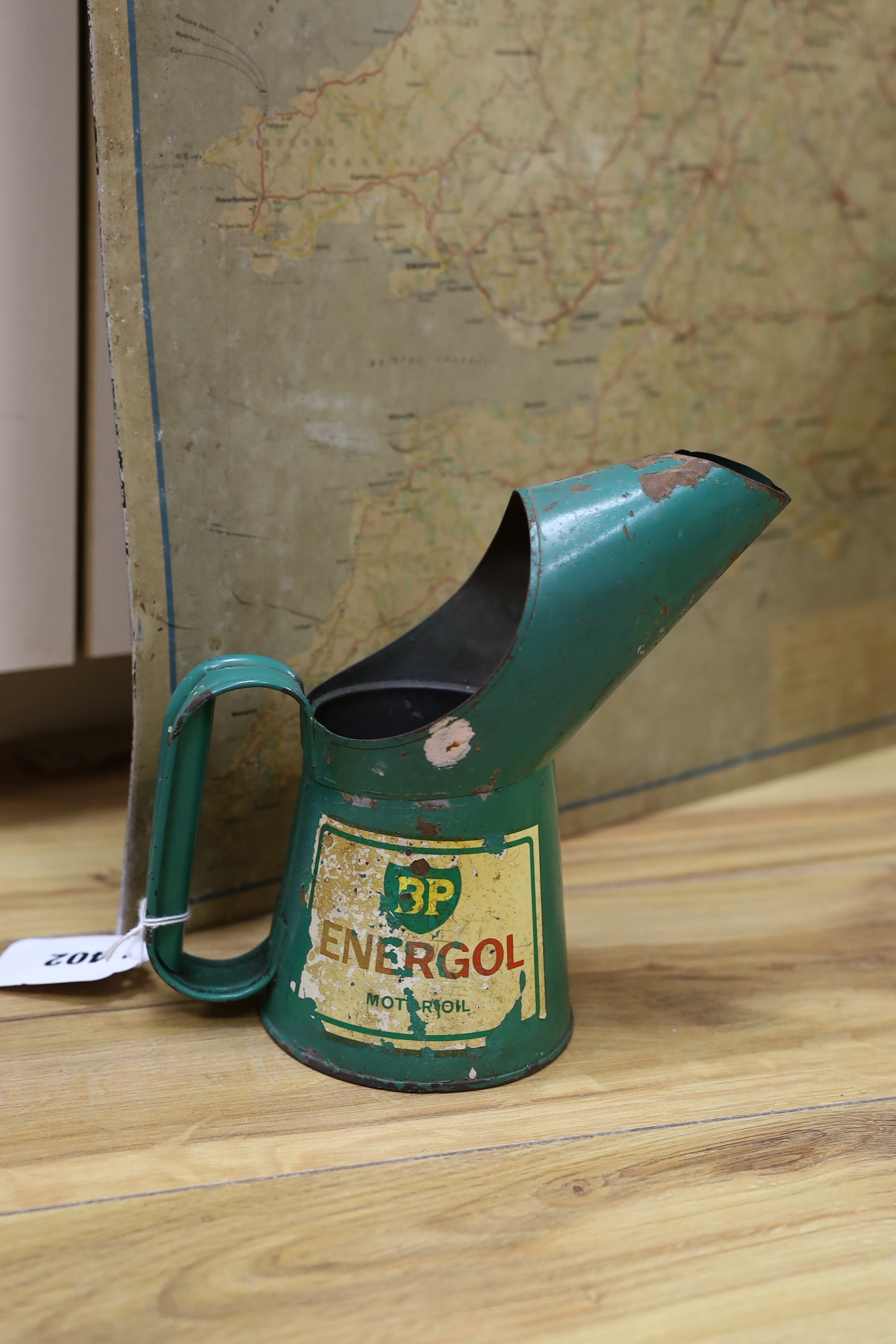 A BP oil can, Michelin motoring map and a revolving globe.